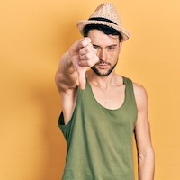 man in tank top giving thumbs down 