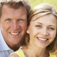 Caucasian man and woman smiling