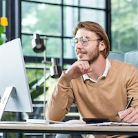 man working by computer